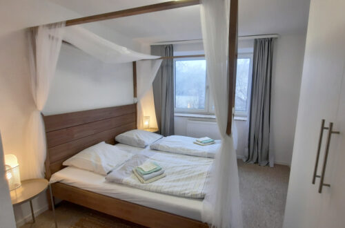 Maison Fasson Ferienwohnung 1 - Schlafzimmer mit Himmelbett