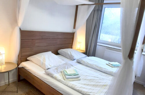 Maison Fasson Ferienwohnung 1 - Schlafzimmer mit Himmelbett