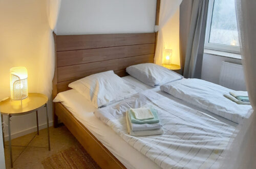 Maison Fasson Ferienwohnung 1 - Schlafzimmer mit Himmelbett